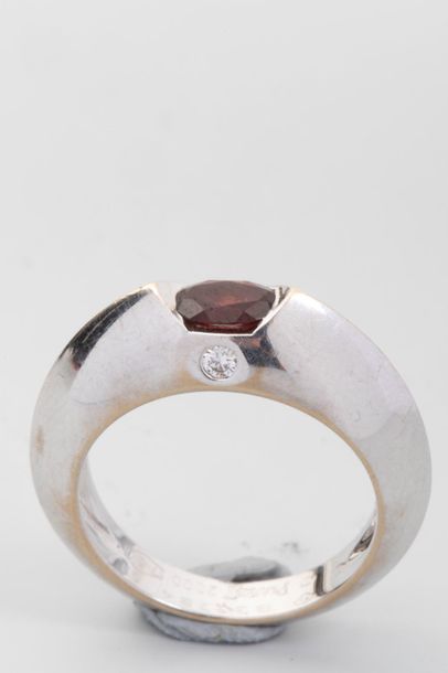 null PIAGET Ring in 18k white gold set with a garnet and a small brilliant Signed...