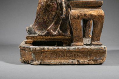 null CHINA, Figure of a scholar sitting on an armchair, holding the sceptre ruyi...
