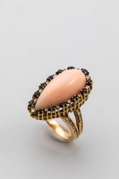 null Marquise ring in 18k yellow gold set with an angel skin coral cabochon in a...