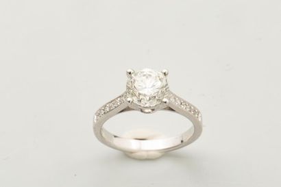 null Solitaire ring in 18k white gold surmounted by a diamond of about 1.55 cts accosted...