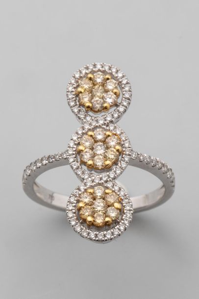 null Trilogy elongated ring in 18k white gold set with modern cut yellow diamonds...