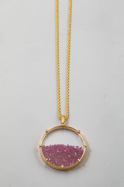 null Circular glass pendant set in gold forming a receptacle of hundreds of small...