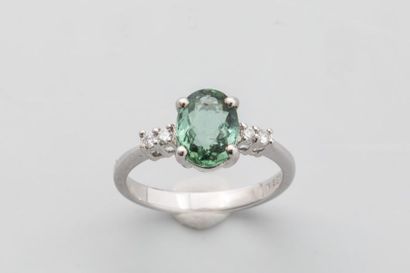null 18k white gold ring set with a green oval cut tourmaline of 1.70 carat with...