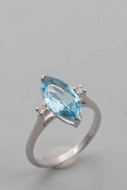 null Navette" ring in 18k white gold set with a 2.5 carat blue topaz, with 2 modern...