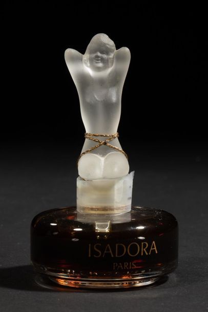 null ISADORA
Flacon en verre de forme cylindrique. Bouchon scellé figurant une
silhouette...