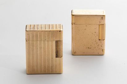 null DUPONT - Two gas lighters in guilloché gold metal