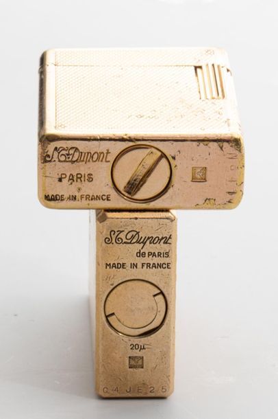 null DUPONT - Two gas lighters in guilloché gold metal
