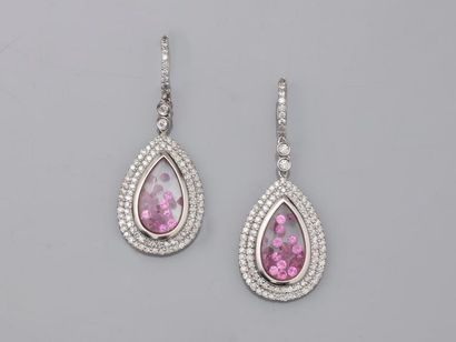 null Pair of 14k white gold drop earrings decorated under glass with calibrated rubies...