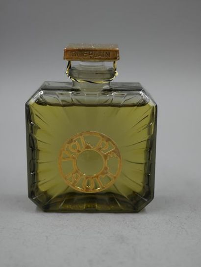 null Guerlain. Night flight. Tinted glass bottle, radiant pattern. Created in 1932....