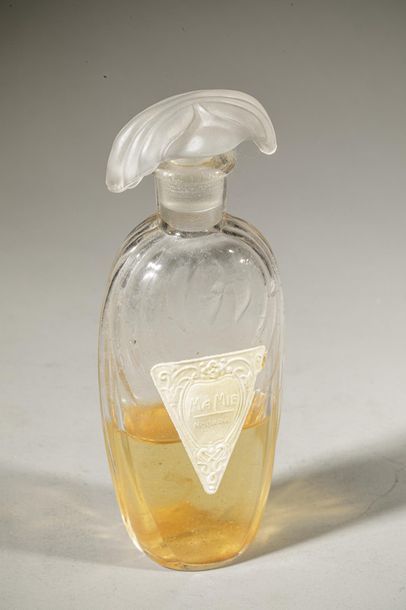 null NOGARA " Ma Mie " Cut-out glass bottle, decorated in relief on both sides. Gold...