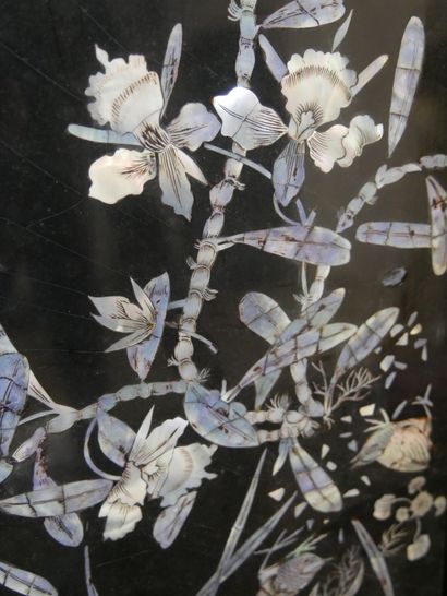 null VIETNAM. Four lacquered and pearly panels decorated with birds on brnachages.100x30cm....