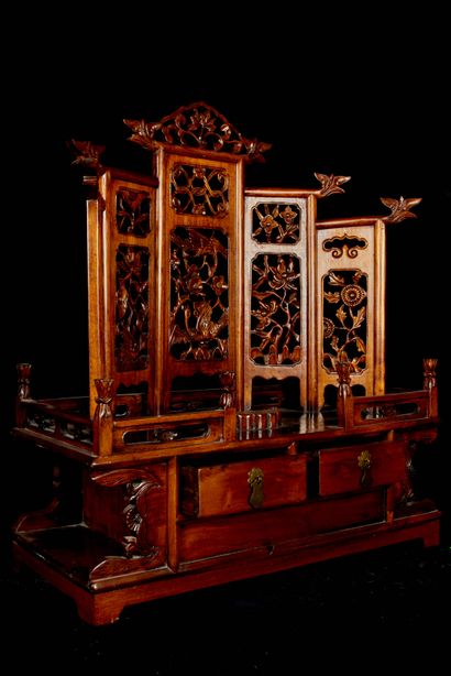 null China, 20th century. Blond wood dressing table opening with two drawers and...