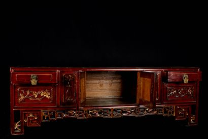 null China, 20th century. Low sideboard with two doors and two drawers. Carved wood...