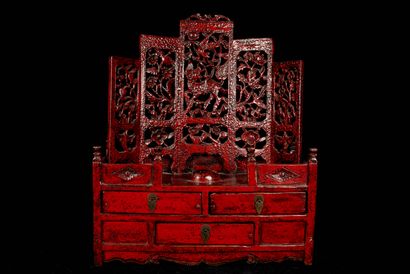 null China, 20th century. A red lacquered wood dressing table opening with three...