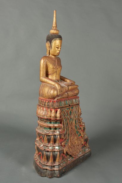null Laos, 20th century. Buddha seated on a stepped pyramidal base. The Buddha, wearing...