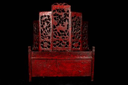 null China, 20th century. A red lacquered wood dressing table opening with three...
