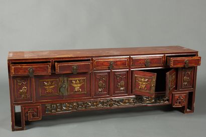 null China, 20th century. Large low carved wood buffet, decorated with motifs symbolizing...