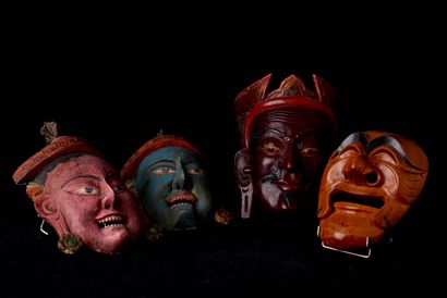 null Various Asia, 20th century. Lot of four wooden masks, some of which are painted....