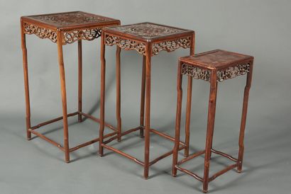 null China, 20th century. Two sets of two nesting stools each. Wood with openwork...