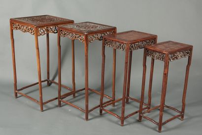 null China, 20th century. Two sets of two nesting stools each. Wood with openwork...