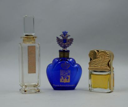 null Set of 3 bottles including "Amun" by Mülhens, a sculptural golden glass bottle...