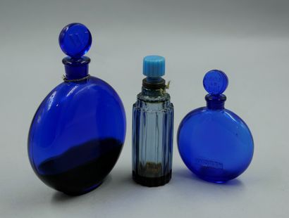 null WORTH

Set of 3 bottles including 2 "Dans le nuit" bottles, in blue glass with...