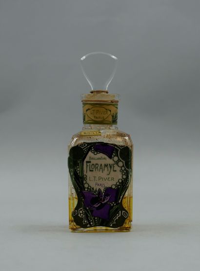 null L.T. PIVER " Floramye "

Glass bottle with decorated and titled label, triangular...