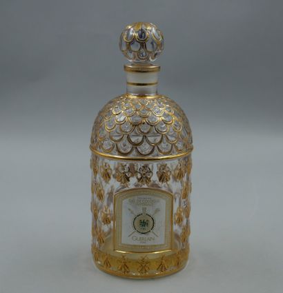 null Guerlain. Bottle model golden bees. Empty. Titled label, engraved under the...