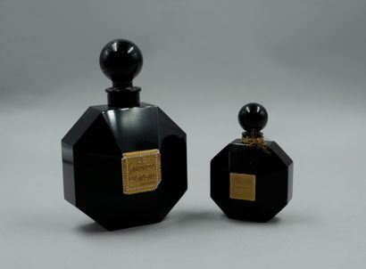 null D'ORSAY " The Dandy "

Set of two black crystal bottles with gold labels and...