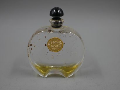 null Avenel perfumer. Jasmine. Round glass bottle, black cap-shaped stopper. Gold...