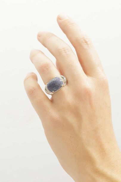 null 18k white gold ring surmounted by a lapis lazuli cabochon, paved with diamonds...