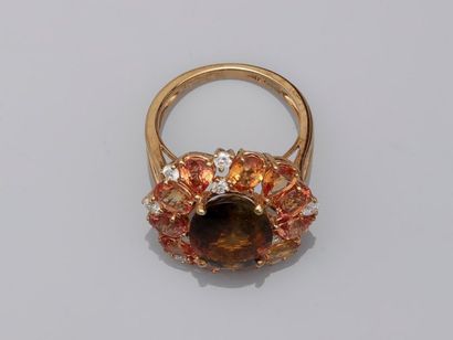 null Margueritte ring in 18k yellow gold surmounted by an orange tourmaline of about...