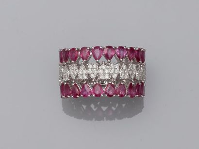 null 18k white gold openwork band ring made of rows of pear cut rubies for about...