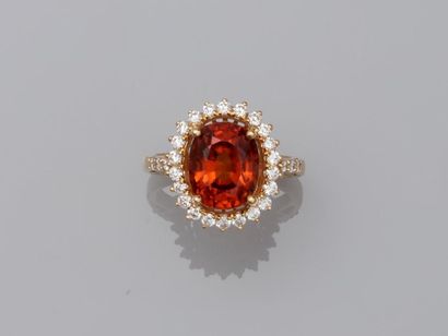 null Daisy ring in 18k yellow gold set with a 5cts oval spessartite garnet in a diamond...