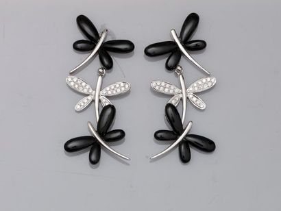 null Pair of 18k white gold mobile ear pendants, each composed of two dragonflies,...