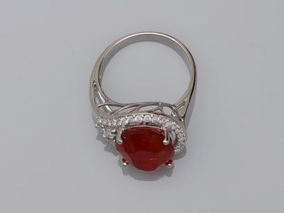 null 18k white gold ring surmounted by an oval Mexican fire opal of about 5cts in...