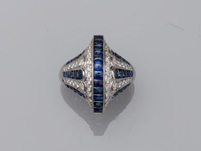 null Platinum "Helmet" ring in Art Deco style composed of lines of calibrated sapphires...