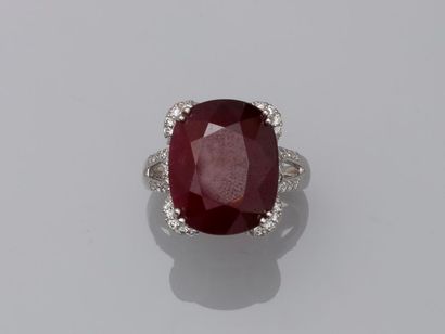 null Ring in 18k white gold surmounted by a cushion cut natural ruby without heat...