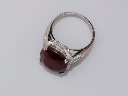 null Ring in 18k white gold surmounted by a cushion cut natural ruby without heat...