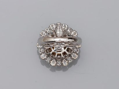 null Flower ring in 18k white gold the pistil composed of a dome of champagne briolette...