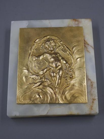 null BARBEDIENNE - Chiseled gilt bronze plaque representing a putto holding a bouquet...