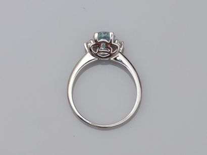 null 18k white gold ring surmounted by a blue topaz of about 1.20cts mounted on an...