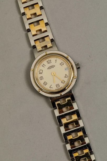 null HERMES PARIS - Bracelet montre en acier et métal doré - Boitier rond, cadran...