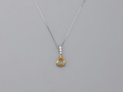 null Pendant in 18k white gold set with a pear cut yellow sapphire of about 1.50cts...