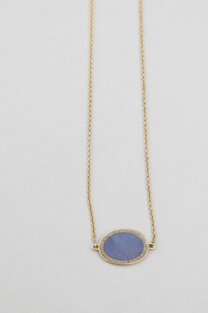 null 18k yellow gold pendant necklace with an oval Lapis Lazulis plate surrounded...
