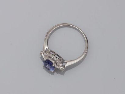 null Ring in 18k white gold surmounted by an oval tanzanite of about 1.20cts surrounded...