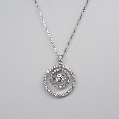 null Pendant Circle in 18k white gold with dancing diamond in its center of about...
