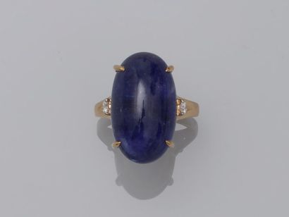 null Ring in 18k yellow gold scratched with an oval tanzanite cabochon of about 20cts...