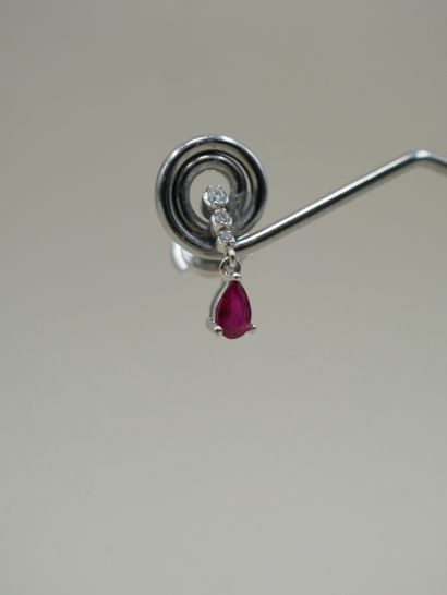 null Pair of small earrings in 18k white gold set with a pear cut ruby held by a...