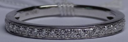 Half wedding ring in 18k white gold set with...